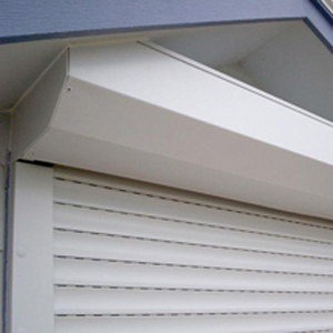 Roll shutters lowered over windows