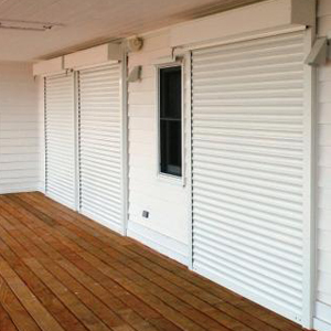 Roll shutters on coastal home