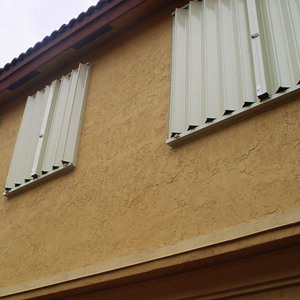 Accordion shutters closed across patio opening