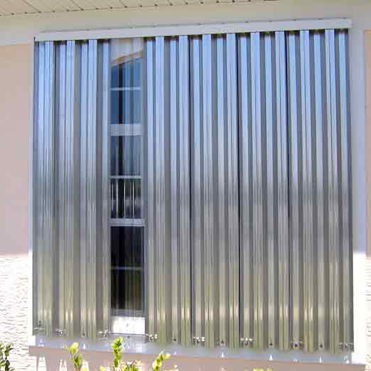 Fixed panel shutters covering windows and doors